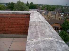 Gaps between coping stones allowing moisture into the wall and building below
