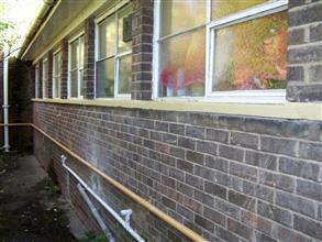 Rebuilt and coated windowsill for long-term protection from concrete spalling